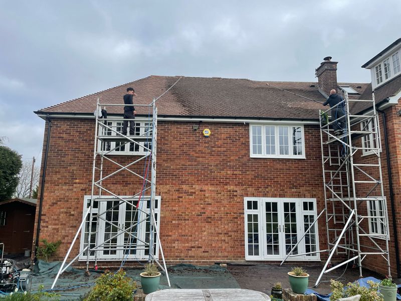 Roof cleaning carried out safely from scaffold towers by The Roof Moss Cleaners in Yateley